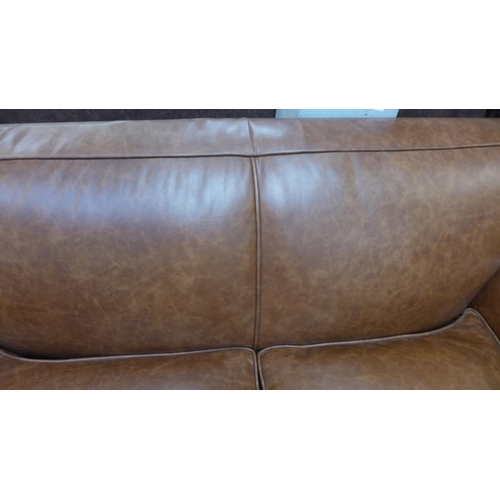 1496 - A Parisian dark tan leather two seater sofa with stud work , RRP £2155 * this lot is subject to VAT