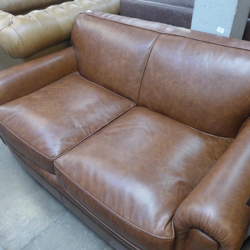 1496 - A Parisian dark tan leather two seater sofa with stud work , RRP £2155 * this lot is subject to VAT