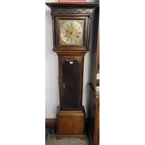 122 - An 18th Century oak 8-day longcase clock, the brass moon-phase rolling dial signed Thomas Knowles