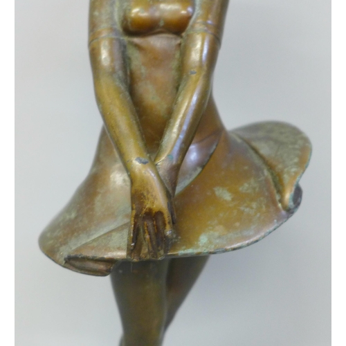 608 - An early 20th Century Art Deco bronzed metal figure of a ballerina on an onyx base, restored, 30.5cm