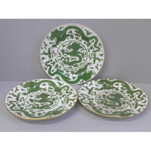 612 - Three Chinese green dragon plates, all a/f (hairline cracks, crazed and chip to rim), 21cm