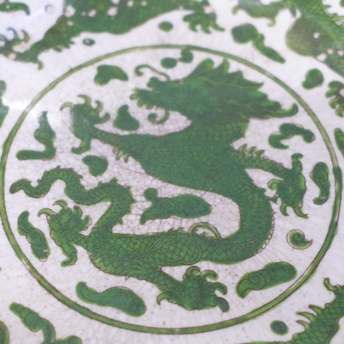 612 - Three Chinese green dragon plates, all a/f (hairline cracks, crazed and chip to rim), 21cm