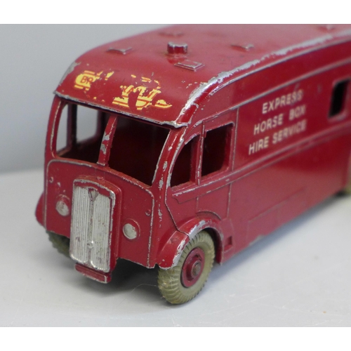 648 - A Corgi Racing Car Transporter and a Dinky Express Horse Box Hire Service vehicle, playworn