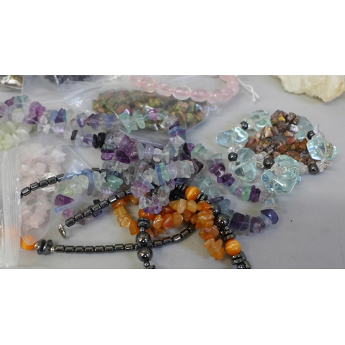 649 - A collection of gemstone bracelets and two crystal geodes