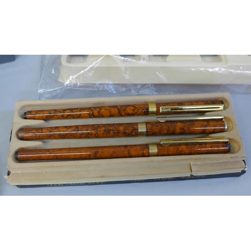 664 - A box of calligraphy pen sets, a Waterman ballpoint pen, Yafa fountain pen, etc.