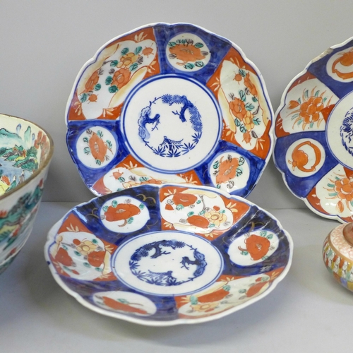 692 - Three Imari dishes, one with chip to rim, a large Chinese bowl, damaged and restored and a pot pourr... 