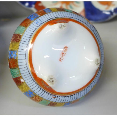 692 - Three Imari dishes, one with chip to rim, a large Chinese bowl, damaged and restored and a pot pourr... 