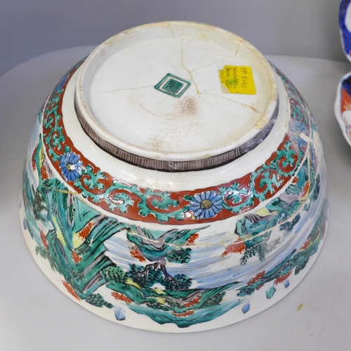 692 - Three Imari dishes, one with chip to rim, a large Chinese bowl, damaged and restored and a pot pourr... 