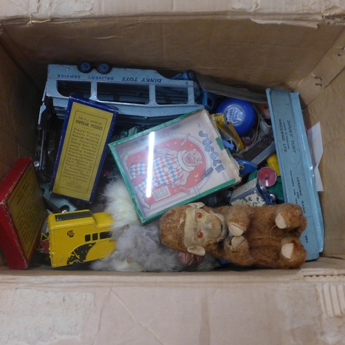 732 - A box of early Dinky and Corgi die-cast model vehicles, a clockwork chimpanzee, a/f and three puzzle... 