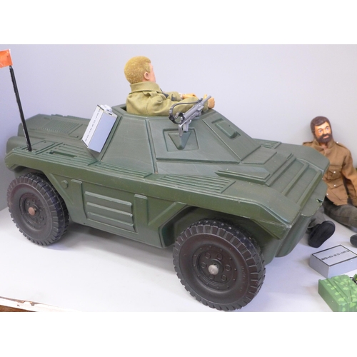 787 - Four vintage Action Man figures and a kit bag and vehicle