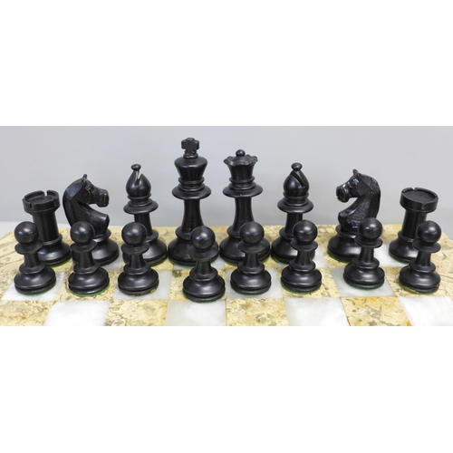 796 - An onyx chess set and one other onyx chess board and wooden chess pieces (complete)