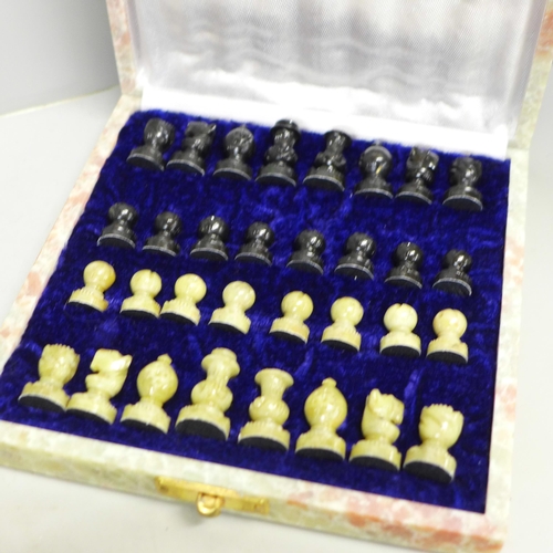 796 - An onyx chess set and one other onyx chess board and wooden chess pieces (complete)