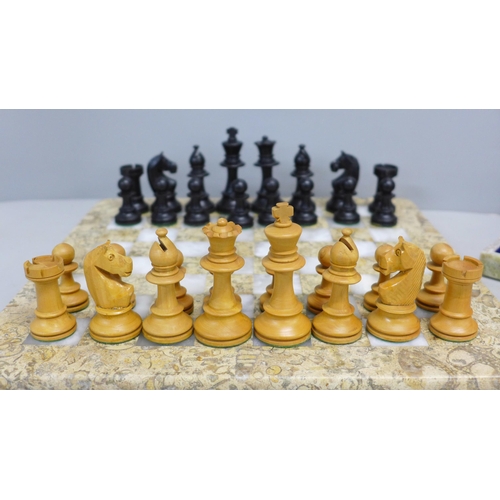 796 - An onyx chess set and one other onyx chess board and wooden chess pieces (complete)