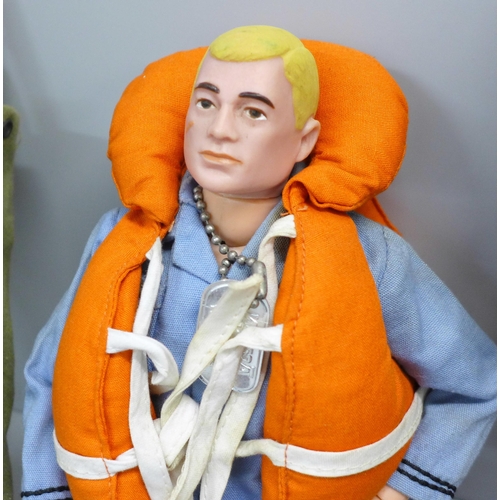 812 - Four vintage Action Man figures and two kit bags