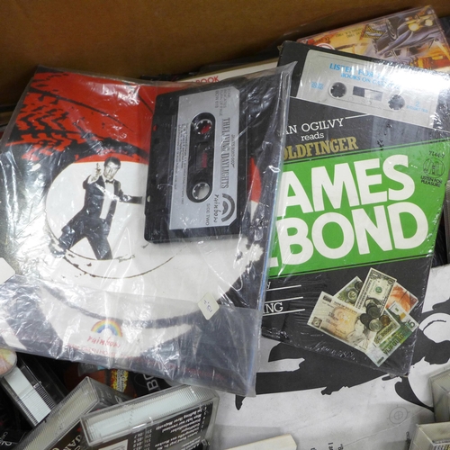 829 - James Bond films and cassettes, with four Talking Storybook cassettes in packets