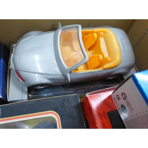 831 - A collection of model sports cars, boxed