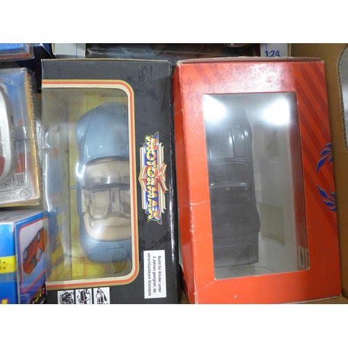 831 - A collection of model sports cars, boxed