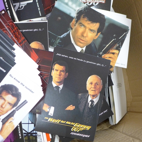 832 - A box of James Bond film postcards