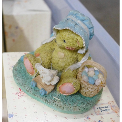 834 - A large collection of Cherished Teddies figures, approximately 33, boxed and a nursery display stand