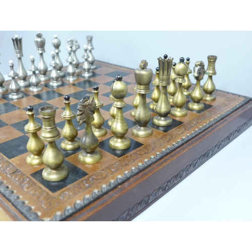 854 - A chess set and board, two metal pieces missing