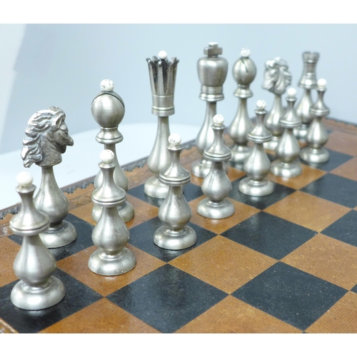 854 - A chess set and board, two metal pieces missing