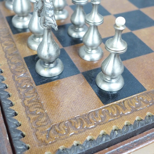 854 - A chess set and board, two metal pieces missing