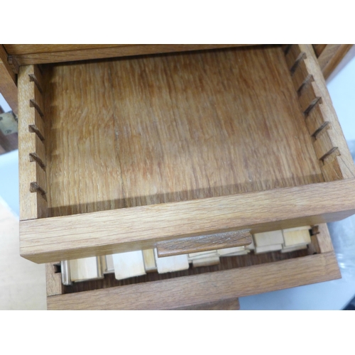 855 - An oak collector's coin cabinet with key