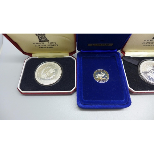 934 - A collection of cased Isle of Man commemorative coins, three sterling silver