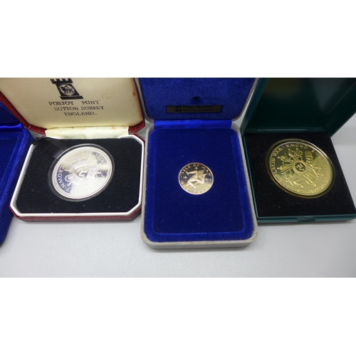 934 - A collection of cased Isle of Man commemorative coins, three sterling silver