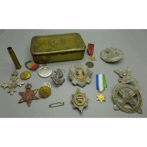 968 - A WWI Christmas tin containing military badges and medals