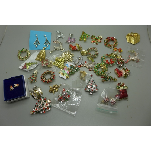 970 - A collection of Christmas themed brooches and earrings