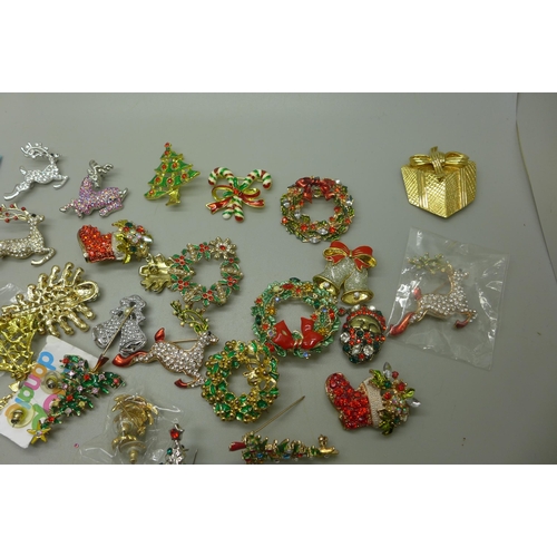 970 - A collection of Christmas themed brooches and earrings