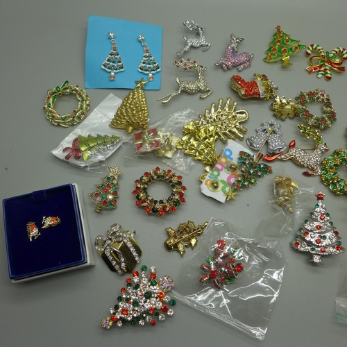 970 - A collection of Christmas themed brooches and earrings