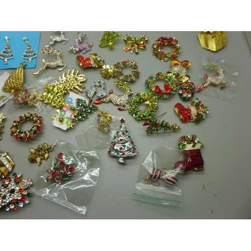 970 - A collection of Christmas themed brooches and earrings