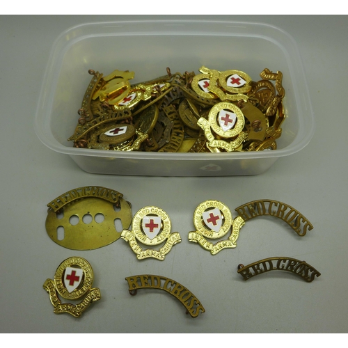 979 - A collection of Red Cross badges and insignia