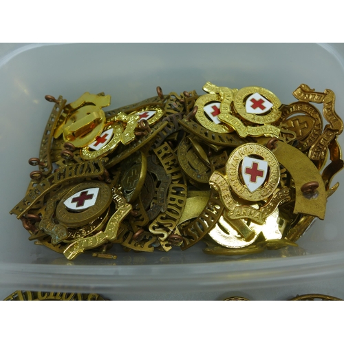 979 - A collection of Red Cross badges and insignia