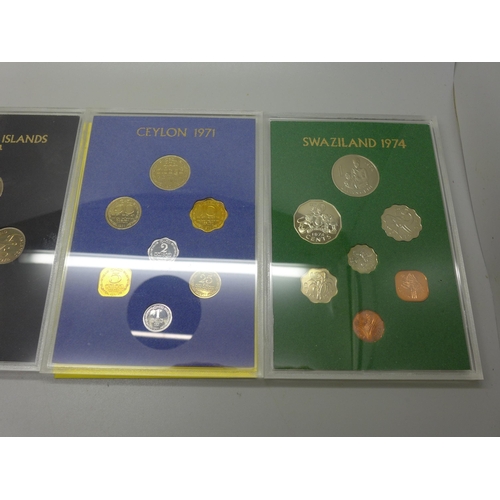 981 - Four Royal Mint commemorative coin sets, Falkland Islands, Swaziland and two Ceylon