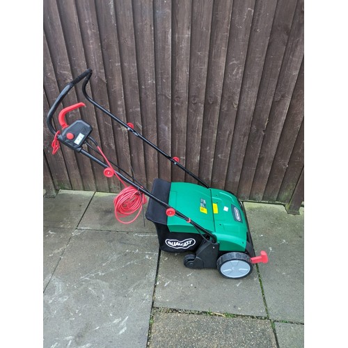 2299 - A Qualcast lawn rake and scarifier - only used once - W