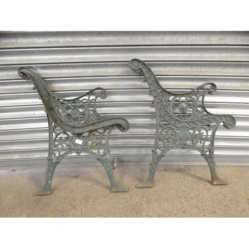 2305 - A pair of cast iron bench ends