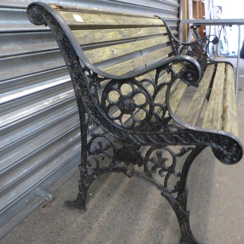 2291 - A wooden bench with cast iron bench ends