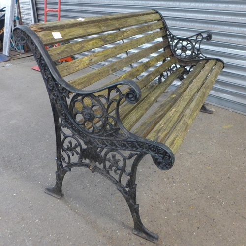 2291 - A wooden bench with cast iron bench ends