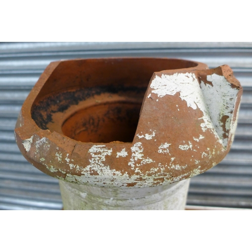 2306 - A galvanised poultry feeder and a terracotta chimney pot