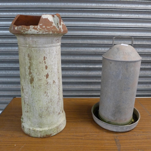 2306 - A galvanised poultry feeder and a terracotta chimney pot