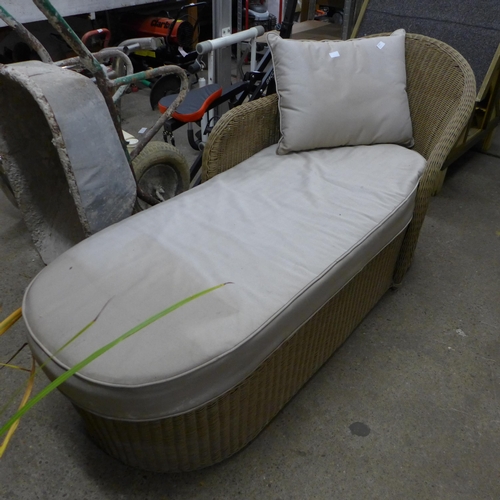 2358 - A rattan chaise lounge