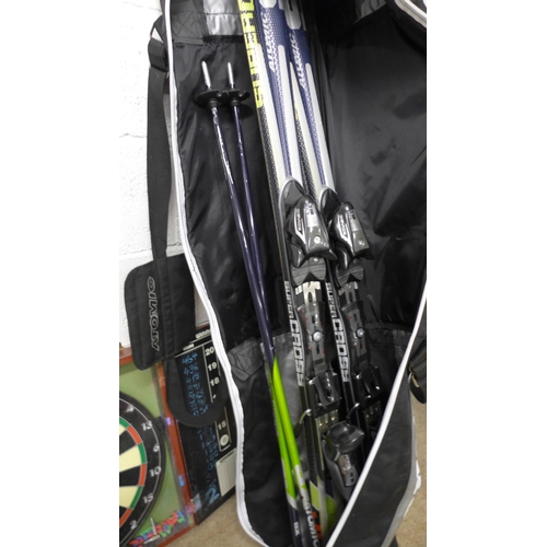 2362 - A selection of sports equipment; 2 dartboards, 1 Winmau and one other, badminton raquets, Atomic ski... 