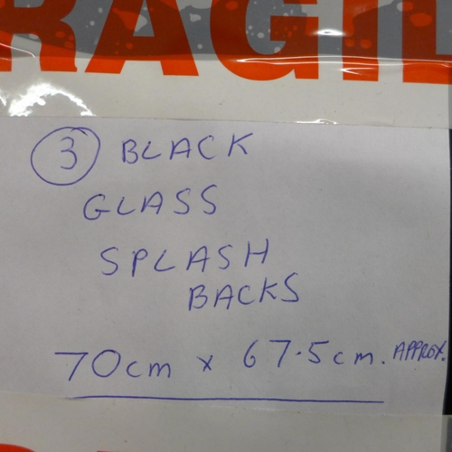 2392 - Three black glass splash backs, size 70cm x 75cm approx.