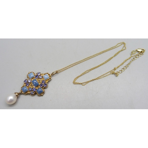 1009E - A silver gilt stone set pendant with pearl drop, on a silver gilt chain, 5cm drop, 7.1g