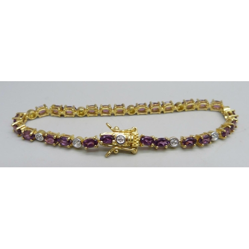 1011 - A silver gilt bracelet set with Sarwood garnet and Cambodian zircon stones, 7.8ct, 18cm, 10.5g