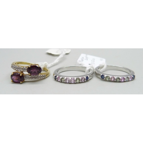 1016 - Three silver rings including two set with rainbow sapphires, N, and one set with sarwood garnets, O/... 