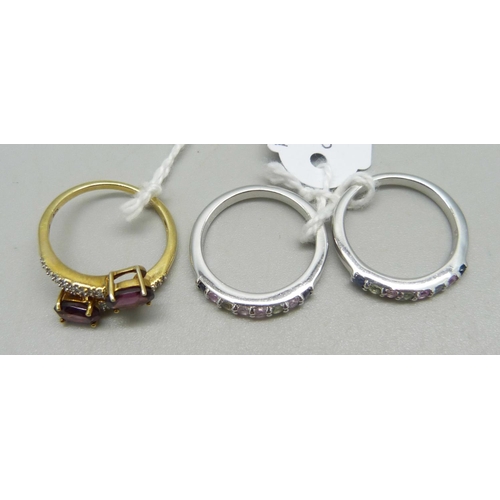 1016 - Three silver rings including two set with rainbow sapphires, N, and one set with sarwood garnets, O/... 